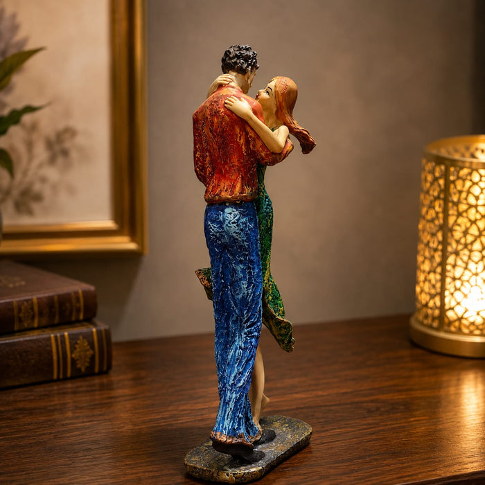A direct front-facing view of the Multicolour Dancing Couple Figurine showcasing its vibrant details and premium finish.