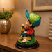The detailed back view of the Multicolour Reading Boy Figurine showing the intricate texture of the material.