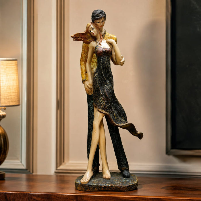 An angled perspective of the Multicolour Standing Couple Figurine highlighting its elegant three-dimensional form and craftsmanship.