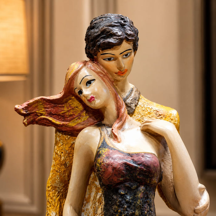 The detailed back view of the Multicolour Standing Couple Figurine showing the intricate texture of the material.