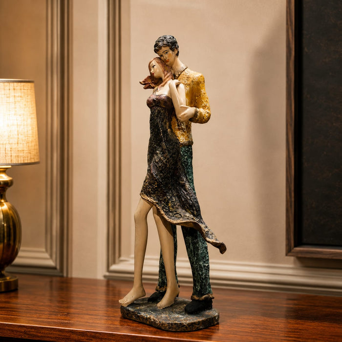 A close-up detail shot of the Multicolour Standing Couple Figurine focusing on the artisanal carving and rich color.