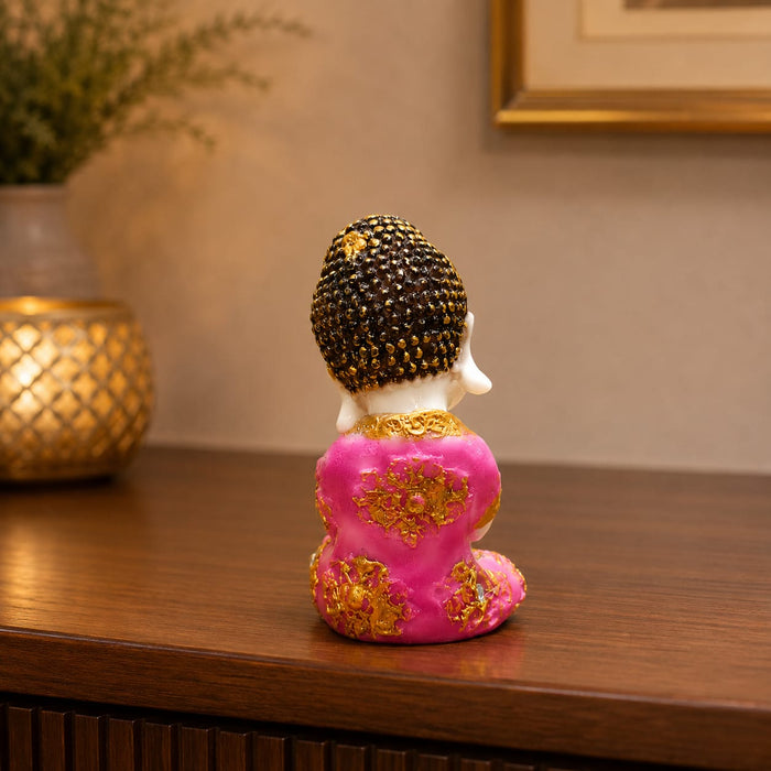 An angled perspective of the Pink Little Buddha Figurine highlighting its elegant three-dimensional form and craftsmanship.