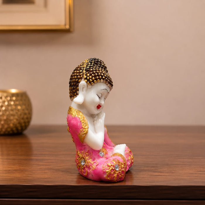 A close-up detail shot of the Pink Little Buddha Figurine focusing on the artisanal carving and rich color.
