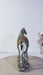 An ornate decorative horse figurine video with a silver-toned body