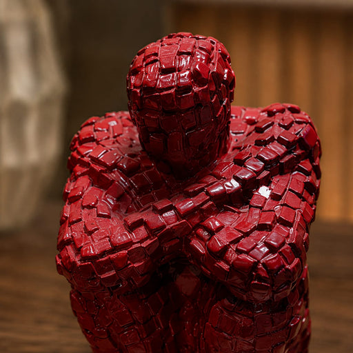 A direct front-facing view of the Red Abstract Yoga Figurine showcasing its vibrant details and premium finish.