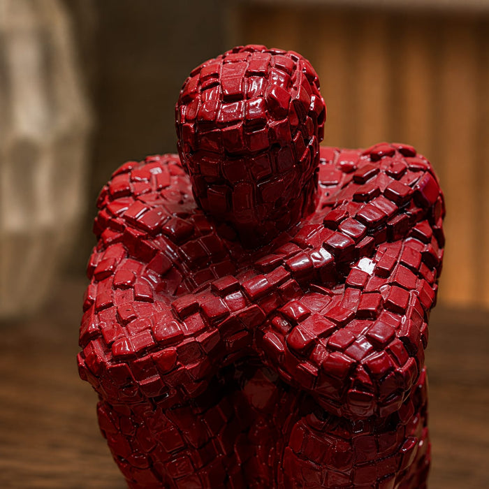 A direct front-facing view of the Red Abstract Yoga Figurine showcasing its vibrant details and premium finish.