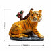 Detailed close-up of hand-painted accents, fine facial detailing, and premium Resin texture on Resting Tiger Resin Figurine with Red Roses (7 Inch)
