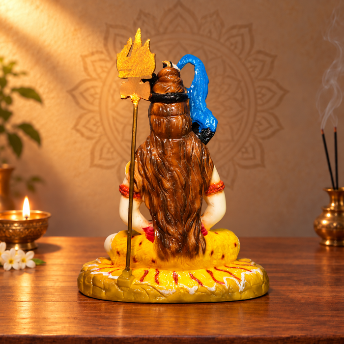 Back view of Shiva idol showing sculpted hair and trident