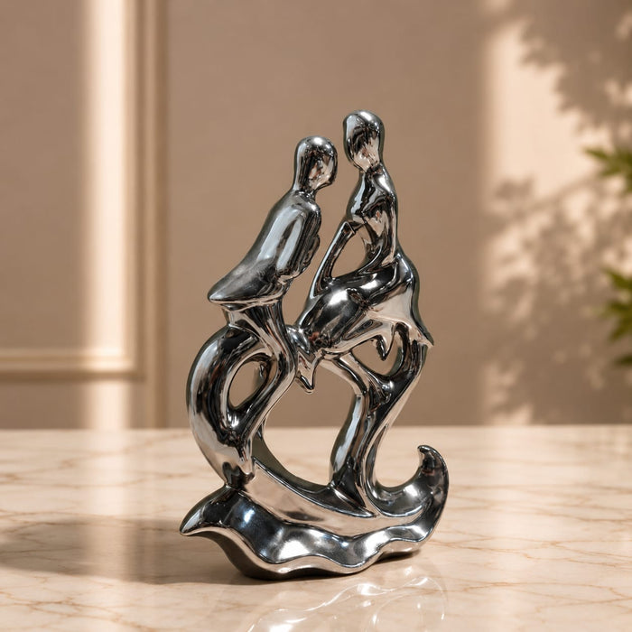 The detailed back view of the Silver Abstract Couple Figurine showing the intricate texture of the material.