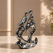 The detailed back view of the Silver Abstract Couple Figurine showing the intricate texture of the material.