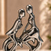 A direct front-facing view of the Silver Abstract Couple Figurine showcasing its vibrant details and premium finish.