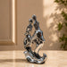 The Silver Abstract Couple Figurine beautifully styled in a modern home interior setting to inspire decor placement.