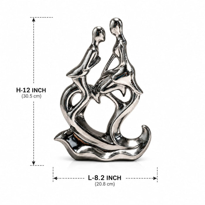 A dimensional diagram illustrating the exact height and width of the Silver Abstract Couple Figurine.