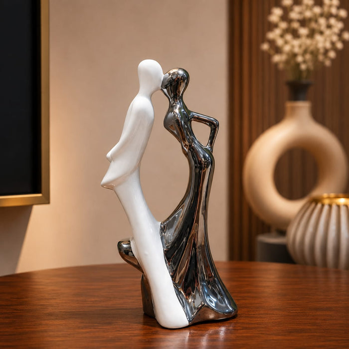 The detailed back view of the Silver Dancing Couple Figurine showing the intricate texture of the material.