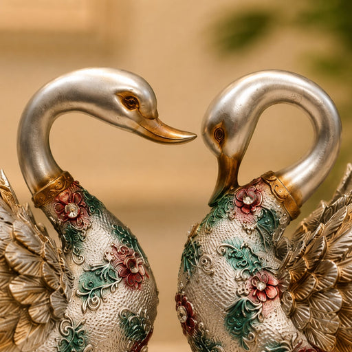 An angled perspective of the Silver Floral Swan Pair highlighting its elegant three-dimensional form and craftsmanship.