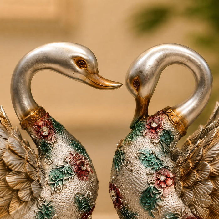 An angled perspective of the Silver Floral Swan Pair highlighting its elegant three-dimensional form and craftsmanship.