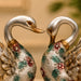 An angled perspective of the Silver Floral Swan Pair highlighting its elegant three-dimensional form and craftsmanship.