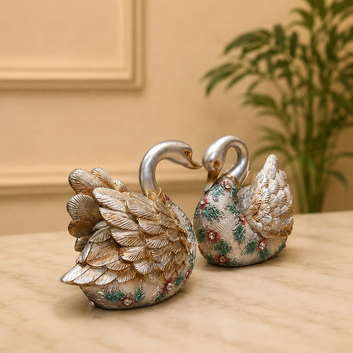 The detailed back view of the Silver Floral Swan Pair showing the intricate texture of the material.