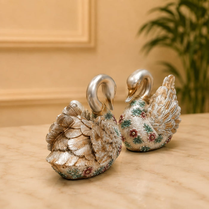 A side profile view of the Silver Floral Swan Pair revealing its graceful silhouette.
