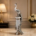 The detailed back view of the Silver Peacock on Pillar showing the intricate texture of the material.
