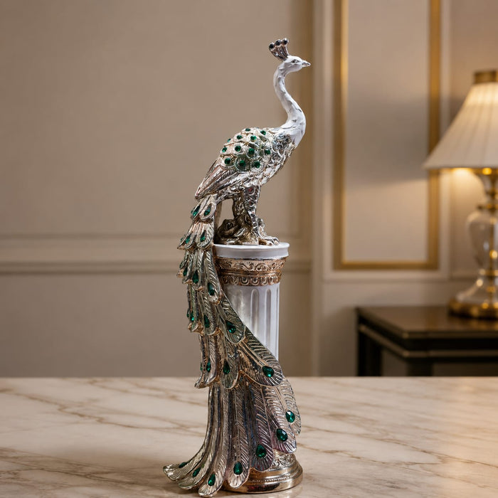 A close-up detail shot of the Silver Peacock on Pillar focusing on the artisanal carving and rich color.