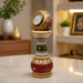 Detailed close-up of vintage analog clock dial, golden Roman numeral face, and embossed Kundan bead work