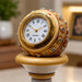 Craftsmanship detail shot of hand-painted floral motifs and red-gold enamel on marble pillar
