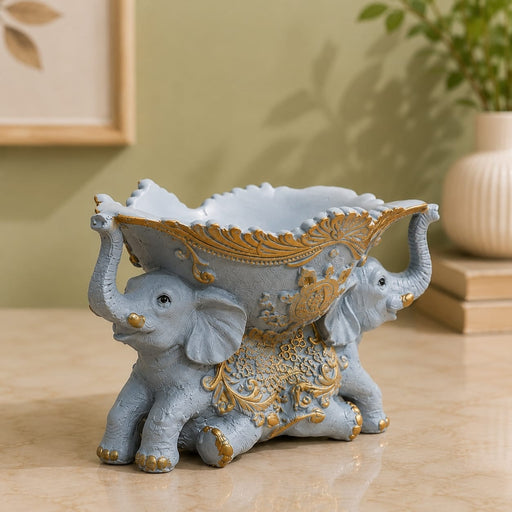 Detailed close-up of hand-painted accents, fine facial detailing, and premium Resin texture on Vintage Grey and Gold Dual Elephant Resin Decorative Bowl (5.4 Inch)