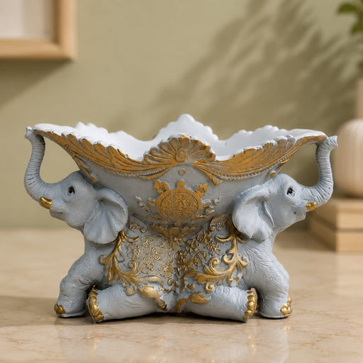 Full front view of Vintage Grey and Gold Dual Elephant Resin Decorative Bowl (5.4 Inch) on display base against clean studio background