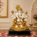 Product feature highlights and craftsmanship overview infographic for White and Gold Ganesha Resin Idol with Red Tilak (10.5 Inch)