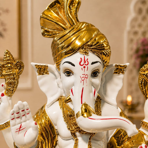 Side profile perspective showcasing elegant three-dimensional contours and sculptural depth of White and Gold Ganesha Resin Idol with Red Tilak (10.5 Inch)