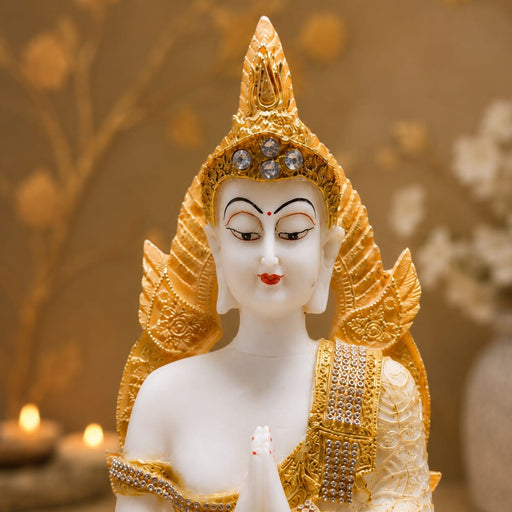 An angled perspective of the White and Gold Buddha Idol highlighting its elegant three-dimensional form and craftsmanship.