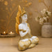 The detailed back view of the White and Gold Buddha Idol showing the intricate texture of the material.