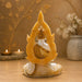 A close-up detail shot of the White and Gold Buddha Idol focusing on the artisanal carving and rich color.