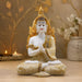 The White and Gold Buddha Idol beautifully styled in a modern home interior setting to inspire decor placement.