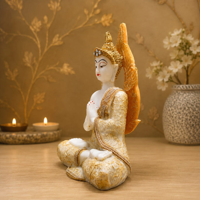 A side profile view of the White and Gold Buddha Idol revealing its graceful silhouette.