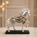 An angled perspective of the White and Gold Horse Figurine highlighting its elegant three-dimensional form and craftsmanship.