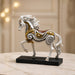 The detailed back view of the White and Gold Horse Figurine showing the intricate texture of the material.