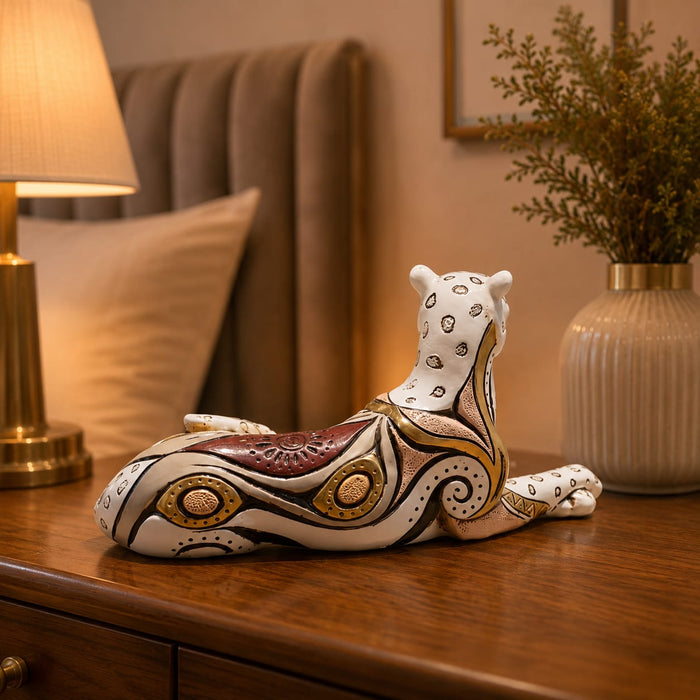 An angled perspective of the White and Gold Leopard Figurine highlighting its elegant three-dimensional form and craftsmanship.