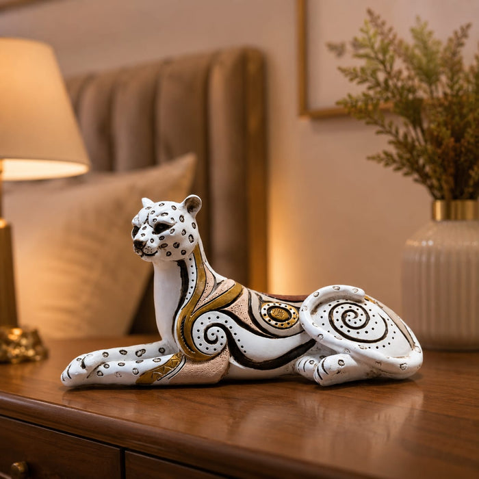 A close-up detail shot of the White and Gold Leopard Figurine focusing on the artisanal carving and rich color.