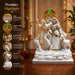 The detailed back view of the White and Gold Radha Krishna Idol showing the intricate texture of the material.