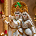 A direct front-facing view of the White and Gold Radha Krishna Idol showcasing its vibrant details and premium finish.