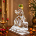 A side profile view of the White and Gold Radha Krishna Idol revealing its graceful silhouette.