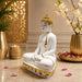 A side profile view of the White Meditating Buddha Idol revealing its graceful silhouette.