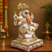 A close-up detail shot of the White and Red Ganesha Idol focusing on the artisanal carving and rich color.