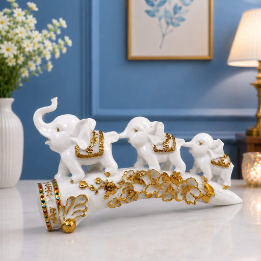 White Resin Elephant Family on Ornate Tusk Showpiece (13 Inch) - View 1