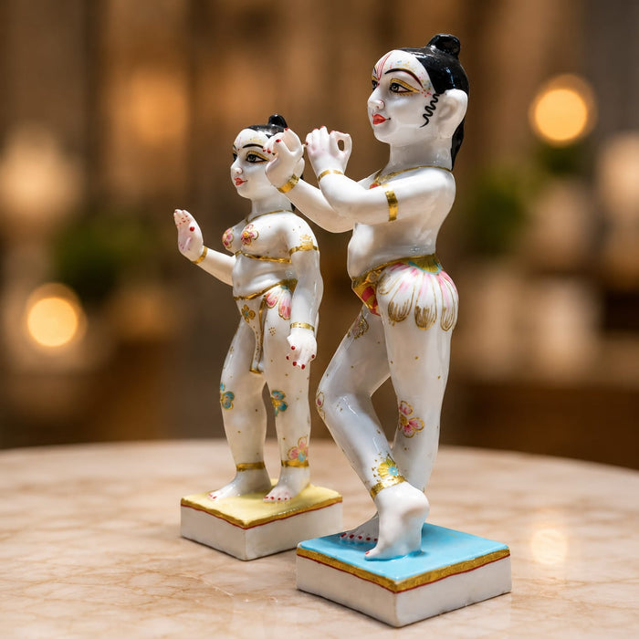 An angled perspective of the White Standing Radha Krishna Idol highlighting its elegant three-dimensional form and craftsmanship.