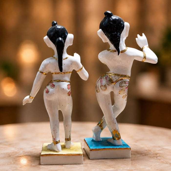 A side profile view of the White Standing Radha Krishna Idol revealing its graceful silhouette.