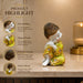 A direct front-facing view of the Yellow Little Buddha Figurine showcasing its vibrant details and premium finish.